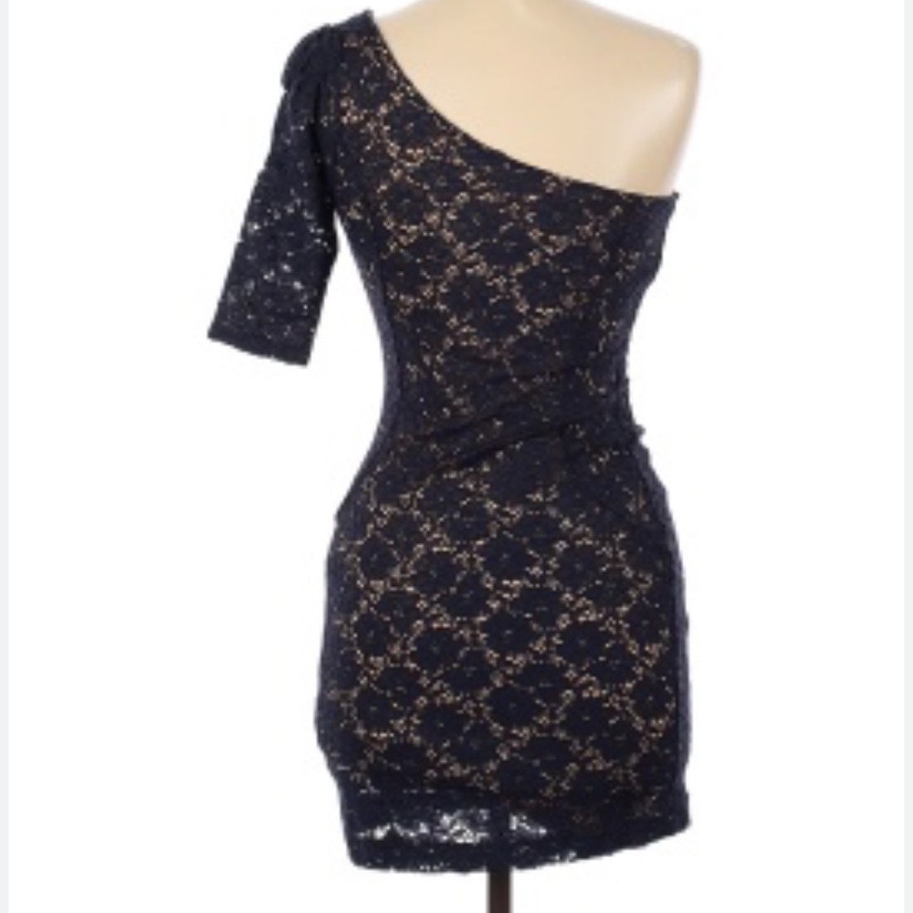 This cute one arm dress is really cute and never used.